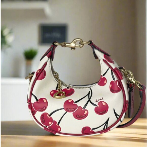 Coach Jonie Cherry Crossbody Mini Bag Wristlet in White Glovetanned Leather CAE8 - Picture 1 of 15